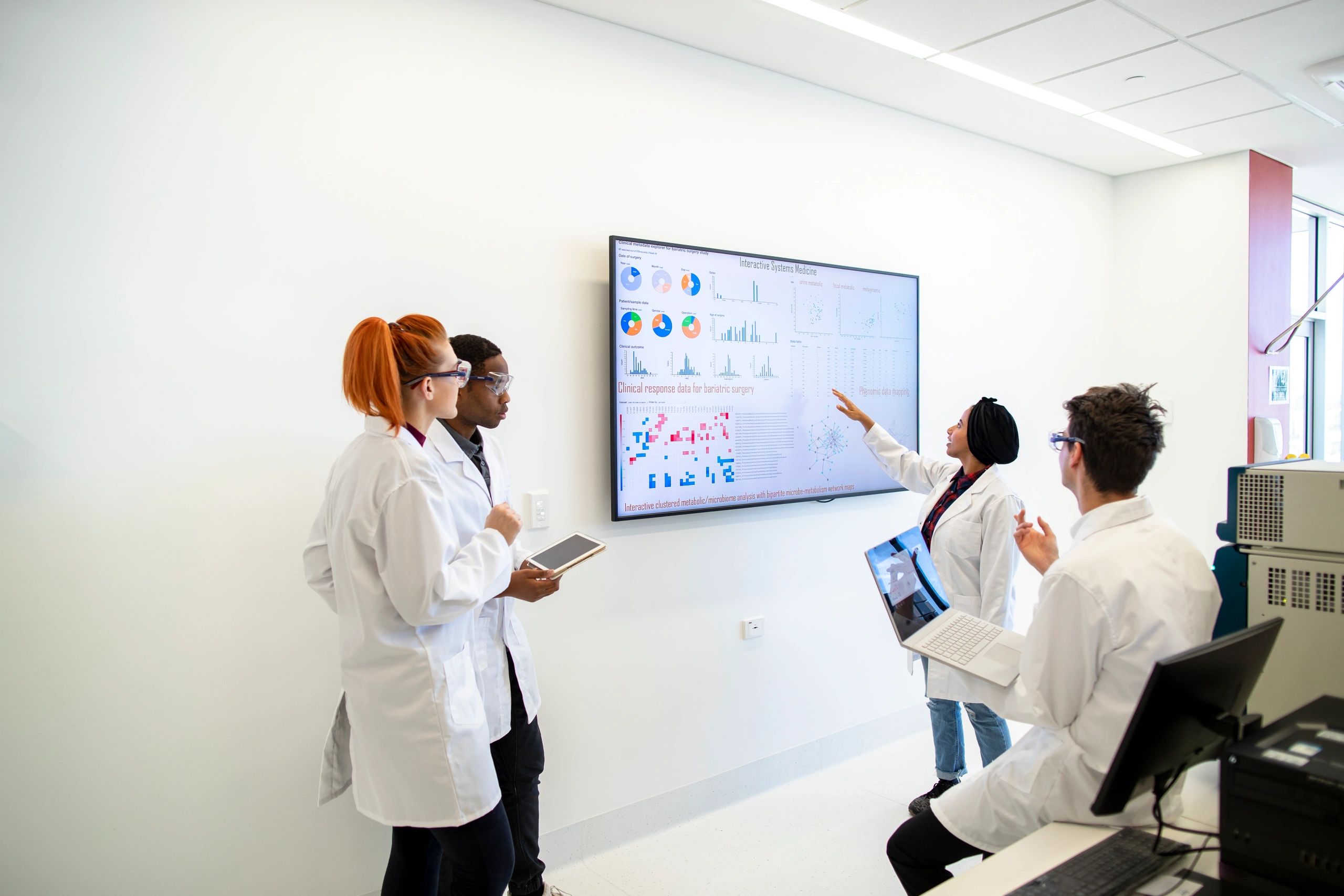 Laboratory team reviewing scientific data together