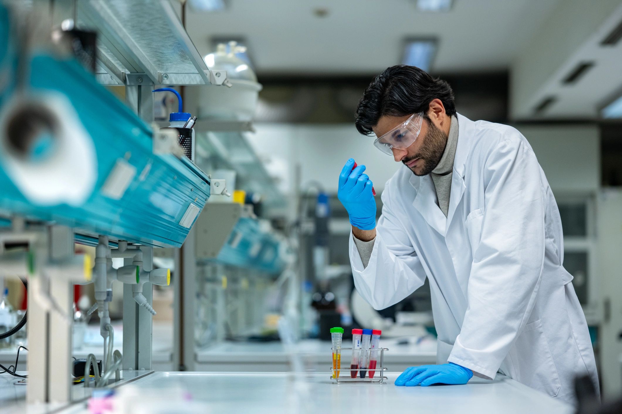 Scientist examining test tubes in a modern laboratory